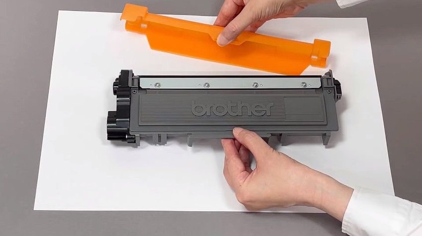 Remove Protective Orange Cover From Toner